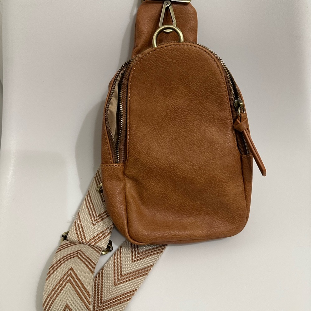 Gently used Anthropologie Aztec sling bag in brown leather